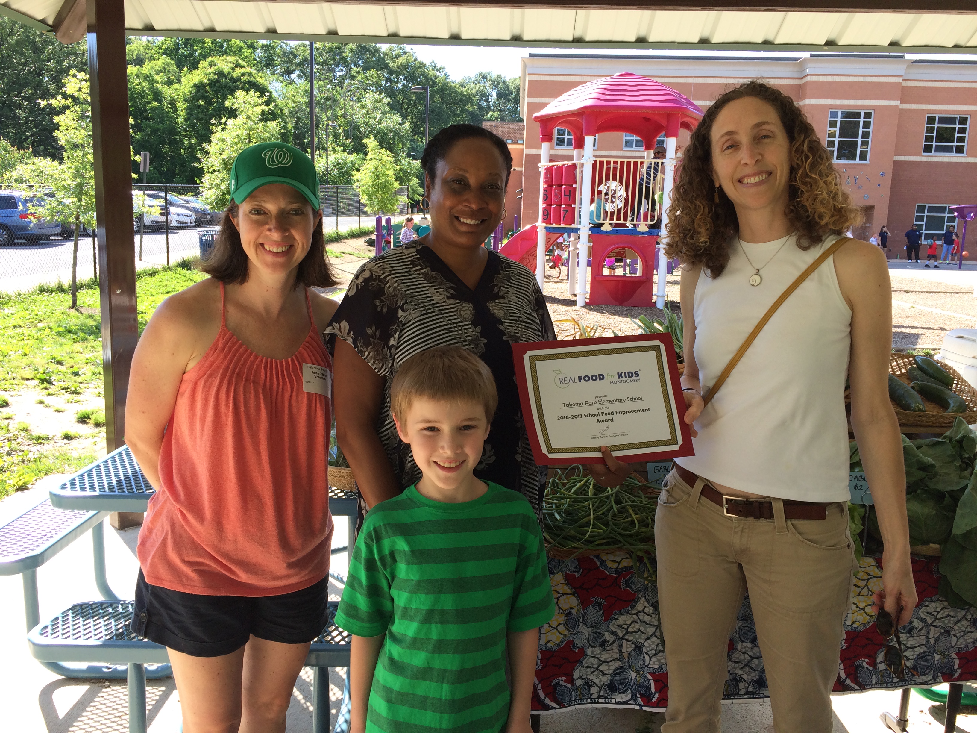 Lindsey holding award